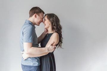 Couple in love having nice time together. Young happy woman hugging her handsome boyfriend. Cheerful casual people students having hopes, dreams, goals