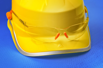 Yellow safety helmet and goggles