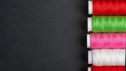 Multicolored threads. Top view, with an empty space under the inscription or advertisement