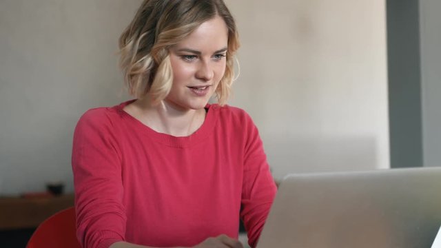 Attractive woman rolling up her sleeves to get some work done
