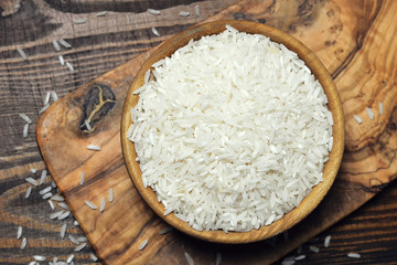 White rice in wooden bowl, top view