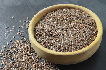 Flaxseeds in wooden bowl
