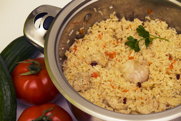tasty plov and vegetables