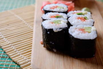 Ready rolls on a wooden stand, ginger