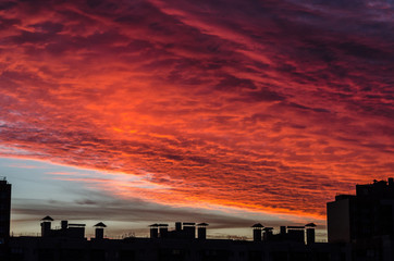 Fototapeta na wymiar Bloody sunset under the industrial depressive city