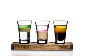 three cocktails on a white background