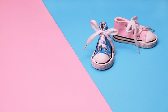 Baby Sneakers On Pink And Blue Background, Boy Or Girl Concept