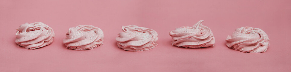 Pink Homemade Zephyr or Marshmallow on Pink Background. Strawberry Marshmallow, Meringue, Zephyr. Banner.