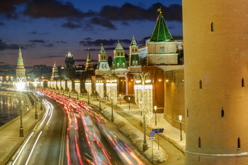 Obraz premium The towers of the Moscow Kremlin and the traffic jam