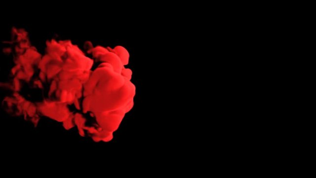 Abstract stylized Red ink drop in water on a black background for effects with Alpha channel matte. 3d render. voxel graphics. computer simulation V1