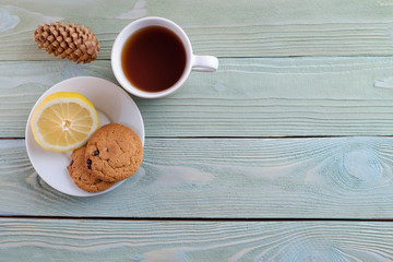 Tea with lemon and cookies