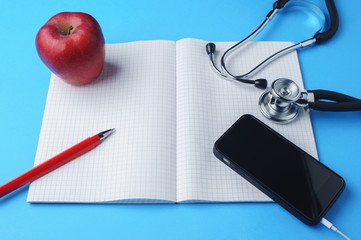 Diary of a doctor, stethoscope, pen