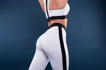 Excellence is the gradual result of always striving to do better. Closeup photo of the perfect female body against the dark blue background in studio.