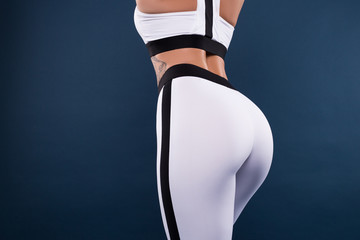 Today is another chance. Make yourself proud. Strong muscular body of the young girl with small tattoo on the side of her waist and with perfect ass in shape of sexy bottom and big butt.