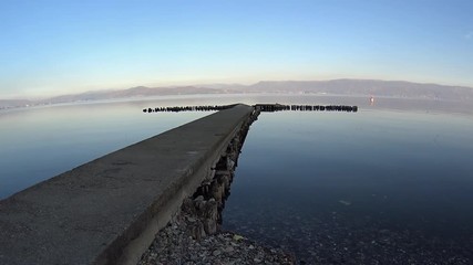 Concrete jetty in calm Ohrid Lake, Radozda, Macedonia