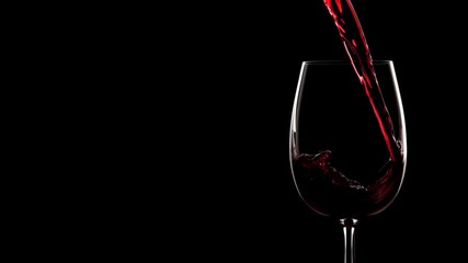 Red wine pouring into glass. Slow motion, silhouette. - Powered by Adobe
