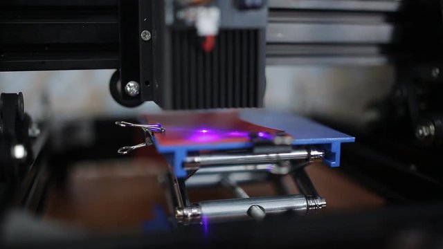 Laser engraved leather on a dedicated machine. Engraved logo on a leather product.