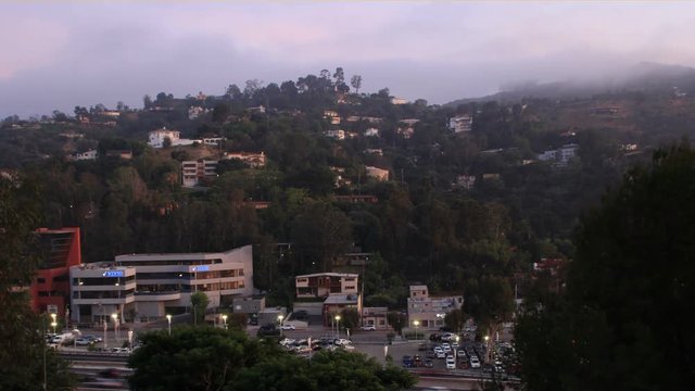 Clouds moving over Hollywood Hills at sunset