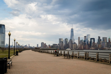Jersey City, NJ / USA  - March 2016: the City of New York as seen from Liberty State Park at the spring cloudy day. 