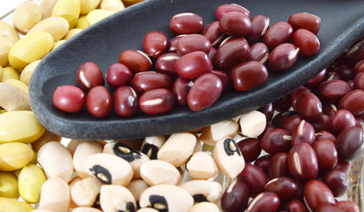 The ranks of different beans . black eyes, adzuki and edamame . View from above.