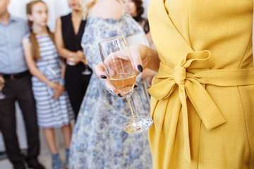 Close-up of woman holding champagne flute