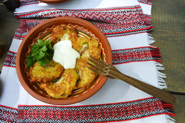 Potato pancakes with sour cream. National ukrainian food.