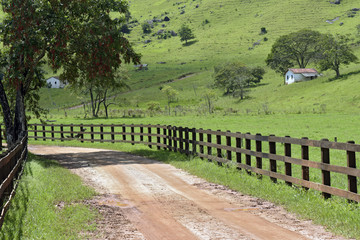 Rural landscape with fence and house