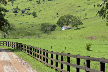 Rural landscape with fence and house