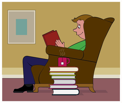 Good Reading / A man reads a book in a comfy chair.