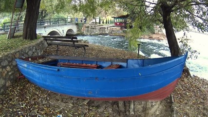 Boat on shore of Ohrid Lake at Saint Naum, Macedonia