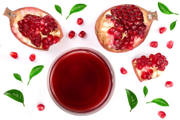 A glass of pomegranate juice with fresh pomegranate fruits decorated with leaves isolated on white background. Top view.