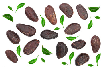 cocoa bean decorated with green leaves isolated on white background top view. Flat lay