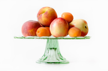 Glass plate with peaches, apricots and nectarines