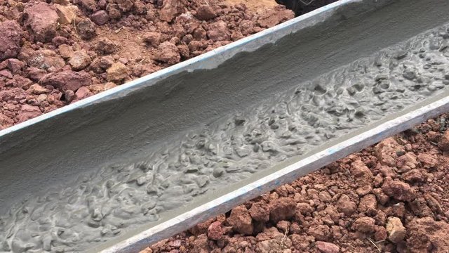 pouring concrete at construction site