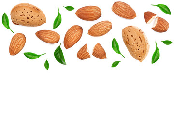 almonds decorated with leaves isolated on white background with copy space for your text. Top view. Flat lay pattern