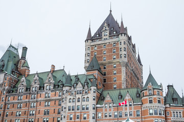 Obraz premium View of Frontenac Castel (Chateau de Frontenac, in French) in winter under the snow. The Château Frontenac is a grand hotel in Quebec City.