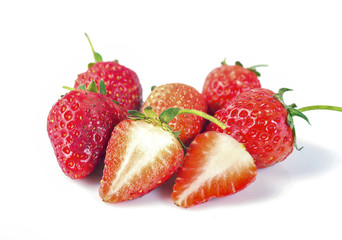 strawberry with sliced half and leaves isolated on white background