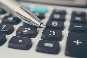 Obraz premium Calculator and pen. Finance and money investment concept
