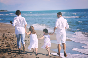 happy young  family have fun on beach