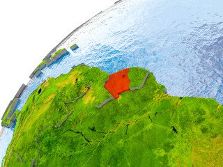 Map of Suriname in red on globe