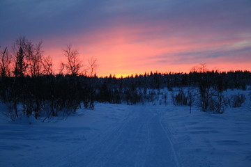 Fototapeta na wymiar Beautiful snowy sunset in the Arctic