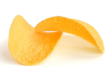 two potato chips on white background close-up