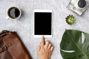 hand using tablet on top view. Clipping path included.flat lay