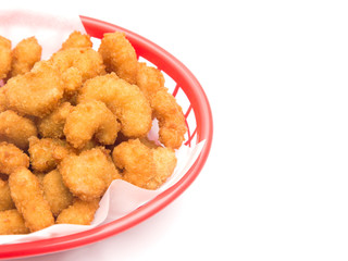 Battered and Fried Popcorn Shrimp in a Basket on a White Background © pamela_d_mcadams