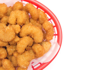 Battered and Fried Popcorn Shrimp in a Basket on a White Background
