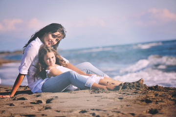 Fototapeta na wymiar mom and daughter portrait on beach