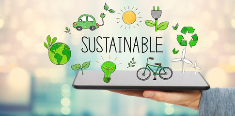 Sustainable with man holding a tablet computer