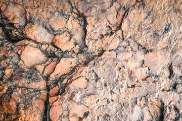 Orange stone background, geology close up