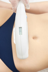 Elos Laser stomach Hair Removal. Epilation Treatment In Cosmetic Beauty Clinic
