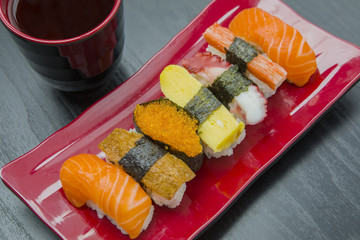 Delicious sushi with soy sauce on the table